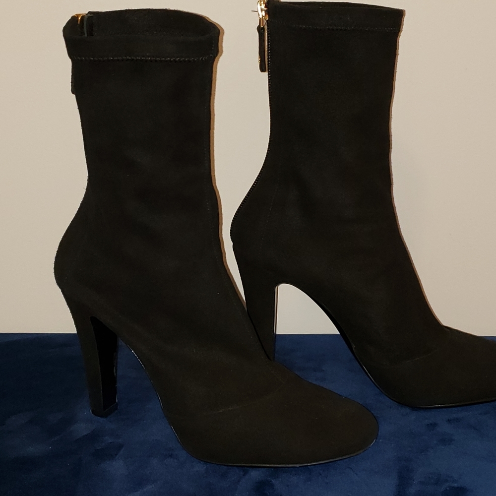 Chanel boots. They run small.  I would say this is a better fit for size 6.